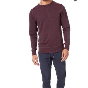 Goodman crewneck shirt.